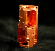 5 Axis precision machining of copper into a part used in the Optics Industry.